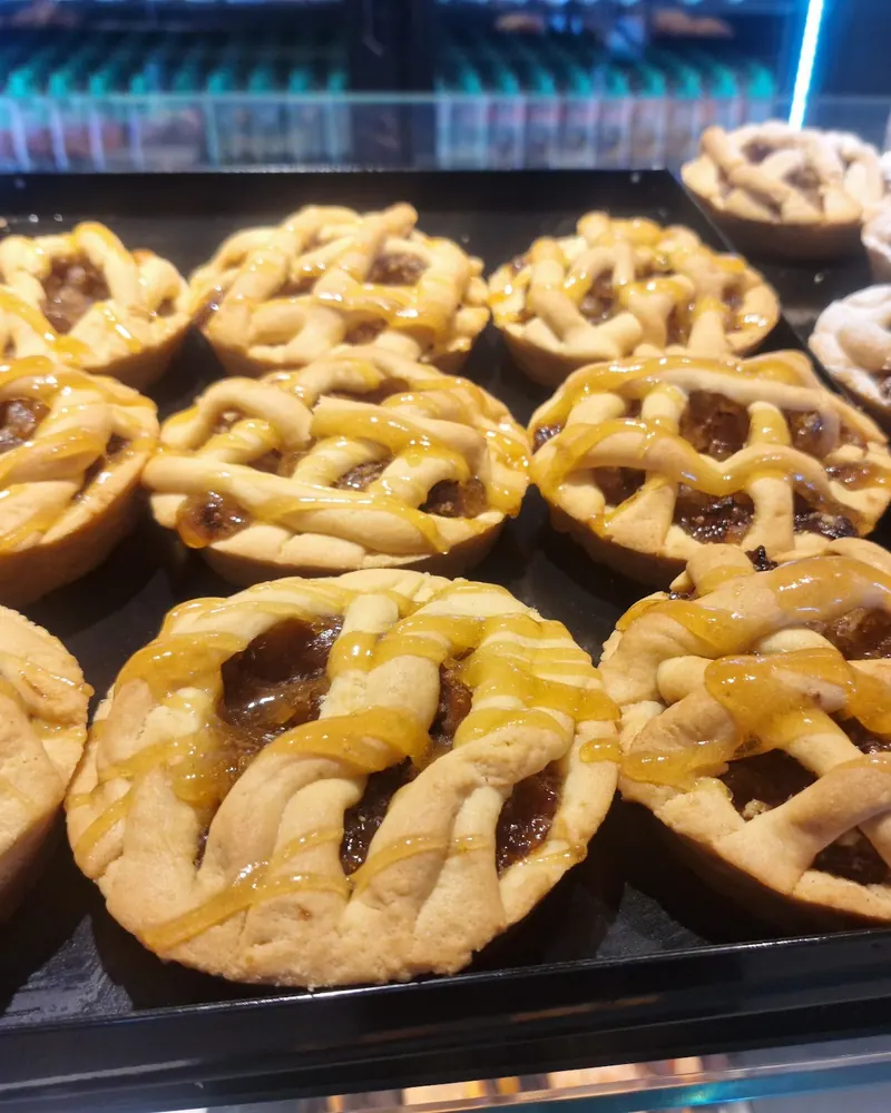 Lattice jam tarts lined up in the display case
